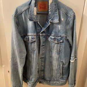Levi’s Ripped Denim Medium Wash Trucker Jacket